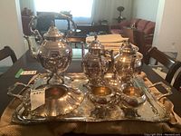 Full view of the Rogers silverplated tea and coffee set arranged on the tray, showing all items included in the lot.