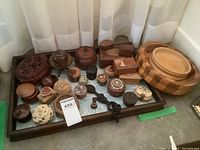 Wide view of tray containing salad bowls and various decorative boxes