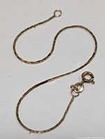 Photo of the full 10K yellow gold bracelet laid out showing length and clasp.