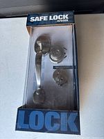 Boxed Weiser Safe Lock door lock system in original packaging showing all components.