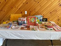 Displayed French teaching resources including games, flashcards, books, and CDs for educational use.