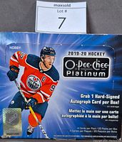 Box of 2019-20 O-Pee-Chee Platinum hockey cards showing the product branding and player image on front.