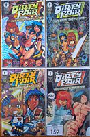 Four comic books from 'The Dirty Pair: Run From the Future' series. Covers feature the two female leads in sci-fi and action themes, surrounded by robotic and futuristic elements. Each comic is in a clear protective bag with backing board.