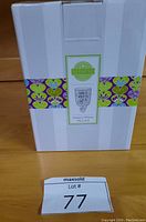 Box with "Home is Where My Cat Is" label on front depicting the wall warmer design