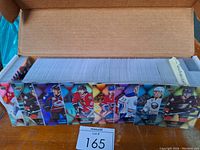 Open box filled with Tim Hortons 2016/17 hockey cards showing player images on the sides of the box.