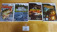 Four Wii game cases placed side by side on a wooden surface showing front cover artwork and titles.