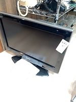 Front view of the 26 inch Sharp flat-screen LCD TV with a black bezel and stand.