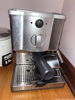 Front view of Breville Cafe Roma espresso machine showing portafilter and control dial