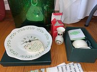 Photo showing porcelain vases, clover clock, and other St. Patrick's Day decor items grouped together
