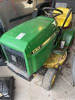 Front angled shot showing hood, grille, front wheels and model decal