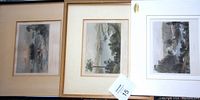 Three hand-tinted landscape prints, two framed and one unframed with white mats, arranged against a wall to show the set