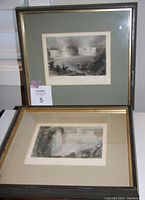 Two framed prints of Niagara Falls, one positioned upright and one flat, showing size and framing details
