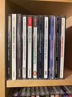 Photo of first shelf with CD spines showing various artists including Quadro Nuevo, Justin Time, Roxy Music, Pharoah Sanders, Rod Stewart, David Sanborn, and Santana.