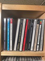 Top shelf showing a row of audio CDs including Van Morrison titles and reggae compilation