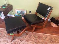 Chair and ottoman side by side on hardwood floor