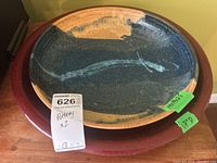 Photo showing the pottery display bowl on top of the glazed terracotta planter tray with visible price tag and green measurement stickers.