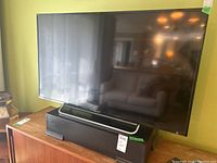 Front view of the television set on the stand