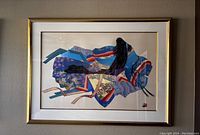 Horizontal geisha print in gold-tone frame with white mat.