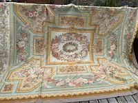 Overall view of full carpet showing central medallion and border