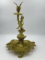 Full view of the candlestick showing cherub, column and base tray