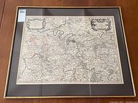 Full view of framed map showing overall condition and split at frame corner