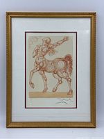 Framed print showing the full centaur artwork with gold-colored ornate frame and appropriate matting.