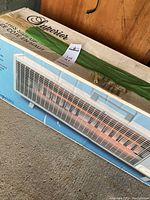 Photo of the fan forced heater in its original box showing the brand and packaging condition.