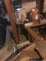 Wide shot of stacked boxes labeled for Christmas decorations with visible angel figure box and assorted cartons with decorations.