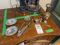 Overview of all sterling silver items displayed on wooden surface