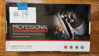 Box showing Legendary Vocal Professional Condenser Microphone with pop filter image and branding