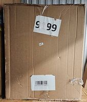Closed cardboard shipping box labeled with lot number and barcode, indicating new condition and unopened items inside