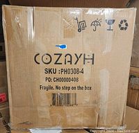 Box packaging labeled Cozayh with SKU PH0308-4 and handling icons indicating fragility and no stepping on the box.