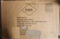 Box showing label with item details: 3pc Bistro Set, color white/natural, new condition, approximate weight 33 lbs.