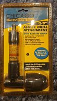 Front view of the Chicago Electric Power Tools 3/8 inch angle drill attachment in sealed plastic packaging showing the product and key features.