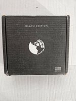 Closed black box labeled 'Black Edition' with globe logo and Made in USA text.