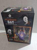 Box showing Huntington Home branding and 4 ft inflatable bat image with lighting up feature.