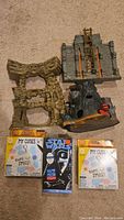 Playsets, boxed My Cuties Night Light toys and Star Wars Black Series figure shown from front view on carpet.