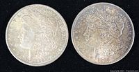 Obverse view of both 1889 and 1890 Morgan Silver Dollars without mint marks.