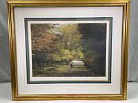 Framed lithograph in gold-painted frame and matted with elegant layers shown fully.