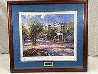 Full front view of framed lithograph print showing the image and matted borders inside a wooden frame.