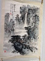 Full view of the watercolor scroll showing mountainous landscape, waterfall, trees, and calligraphy.