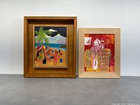 Frontal photo of two paintings side by side: left is a detailed colorful beach party oil painting, right is an abstract acrylic painting by Julia Balfour in reds and oranges.