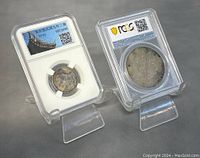 Front view showing both PCGS-encapsulated coins on clear stands