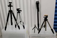 Full view of all 5 items in the photo accessory lot, showing variety of tripods and monopod