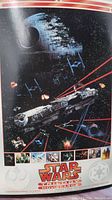Close-up photo of a Star Wars 11x14 print showing the Death Star battle scene with the Millennium Falcon and TIE Fighters.
