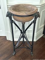 Full front view of marble bowl on bronze tripod base