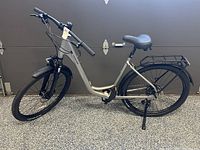 Full left side profile of bicycle showing frame, wheels, rack, and fenders