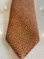 Tie front view laid flat on countertop showing full pattern and color.