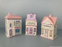 Three containers front view showing Dill, Marjoram, Paprika labels and facade details