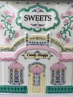 Front view showing ‘Sweets’ signage and ‘Candy Shoppe’ label beneath decorative canopy